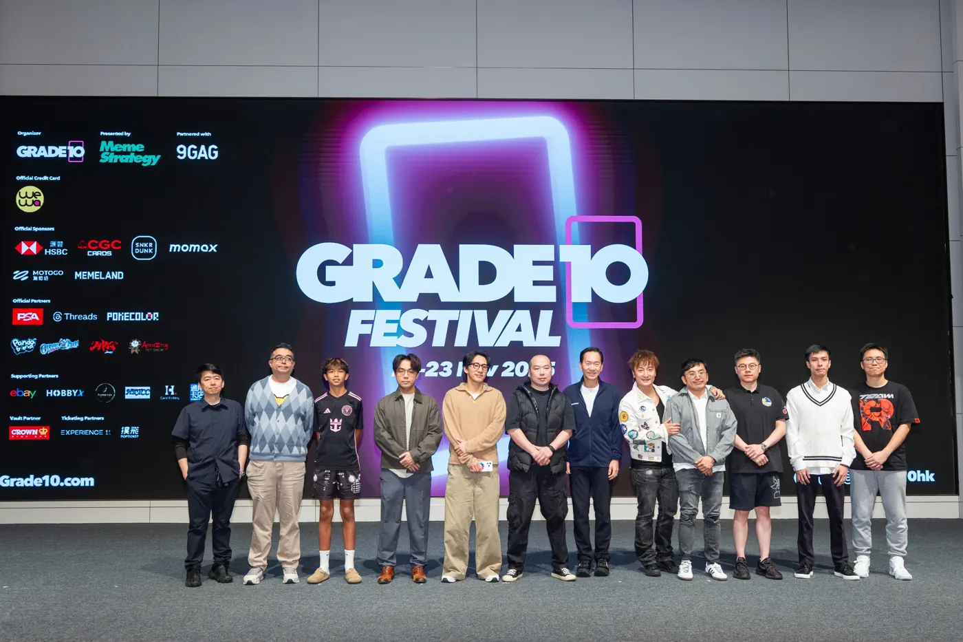 Grade10 Festival partners standing in front of the main festival backdrop.
